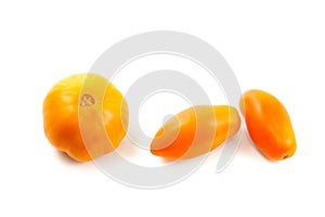 Assort of different shape of yellow tomatoes isolated on white background with clipping path