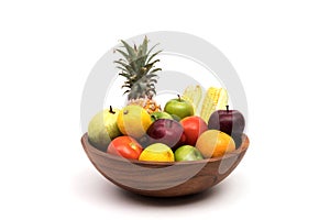 Assort fresh fruits and vegetables in basket isolated on white background