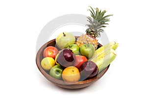 Assort fresh fruits and vegetables in basket isolated on white background