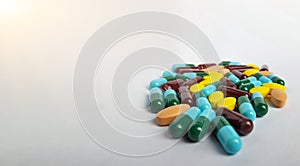 Assort pharmaceutical medicine pills, orange tablets, blue and green capsules