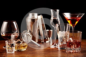 Assorted alcoholic beverages and bar utensils