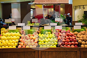 Assorted apples on display at supermarket