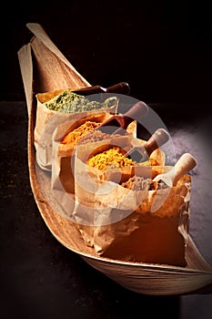 Assorted Asian spices in brown paper packets