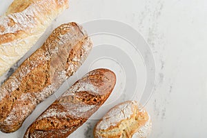 Assorted bakery products including loafs of bread