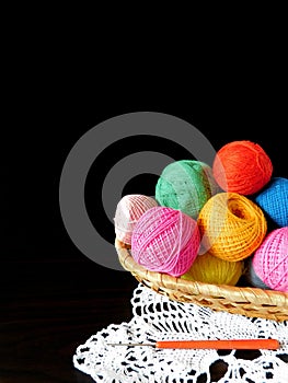 Assorted balls of yarn in a basket