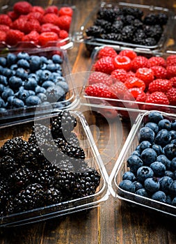 Assorted Berries on wood background