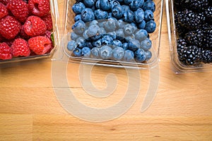 Assorted Berries on wood background