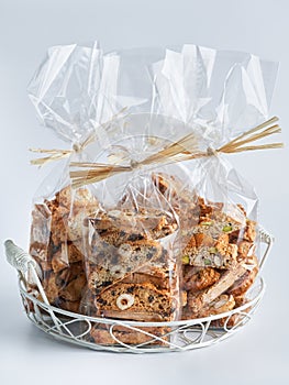 Assorted Biscotti Cantucci Biscuits Cookies in plastic wrap packaging for sale. Italian dessert cookies close up, selective focus