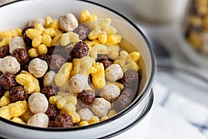 Assorted breakfast cereals: chocolate balls and honey stars