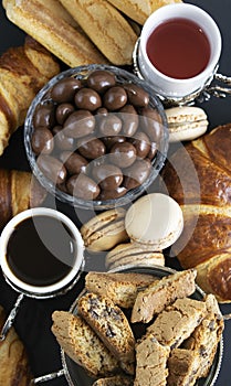 Assorted breakfast food with coffee and tea