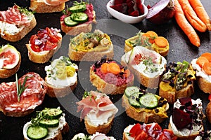 Assorted bruschetta with various toppings. Appetizing bruschetta or brie crostini. Variety of small sandwiches. Mix bruschetta on