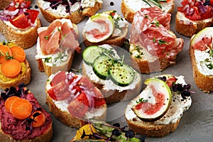 Assorted bruschetta with various toppings. Appetizing bruschetta or brie crostini. Variety of small sandwiches. Mix bruschetta on