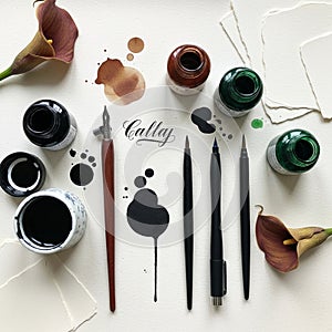 Assorted calligraphy tools arranged on a