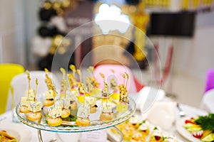 Assorted canapes for the festive table. Catering services for banquets.