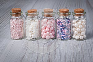 Assorted candy sprinkles in mini glass bottle