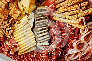 Assorted cheese and meat platter with snacks