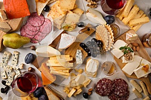 Assorted cheese, sausages and fruit