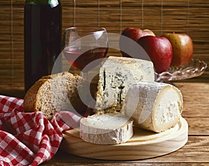Assorted cheese on a wooden board