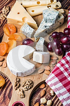 Assorted cheeses with grapes and nuts