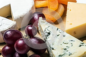 Assorted cheeses with mold, Maasdam, Roquefort, brie