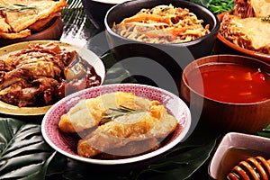 Assorted Chinese food set. Chinese noodles, fried rice, peking duck, dim sum, spring rolls. Famous Chinese cuisine dishes on table