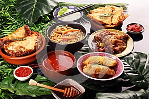 Assorted Chinese food set. Chinese noodles, fried rice, peking duck, dim sum, spring rolls. Famous Chinese cuisine dishes on table