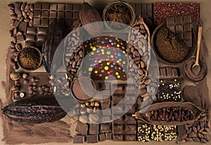 Assorted chocolate bar, candy sweet, cocoa pod, natural paper background