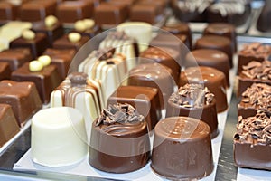 Assorted chocolates displayed on table, perfect for dessert lovers