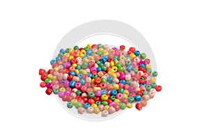 Assorted colored plastic beads on a white background