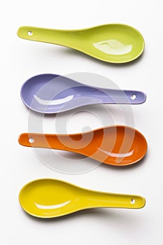 Assorted colorful chinese soup spoons.