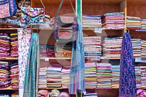 Assorted colorful fabrics on display in a shop Muttrah Souk, in Mutrah, Muscat, Oman, Middle East photo