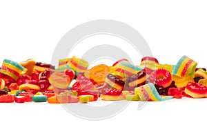 Assorted colorful gummy candies. Top view. Jelly donuts. Jelly bears. Isolated on a white background