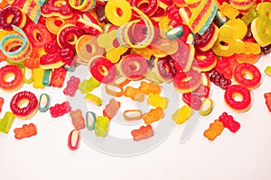 Assorted colorful gummy candies. Top view. Jelly donuts. Jelly bears. Isolated on a white background