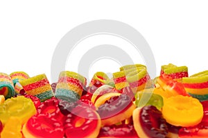 Assorted colorful gummy candies. Top view. Jelly donuts. Jelly bears. Isolated on a white background