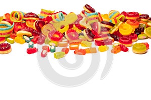 Assorted colorful gummy candies. Top view. Jelly donuts. Jelly bears. Isolated on a white background