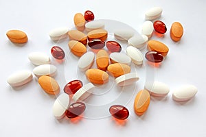 Assorted colorful pharmaceutical medicine pills, tablets and capsules on white background. Pharmacy theme, health care, drug presc