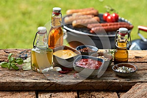 Assorted condiments and spices on a picnic table