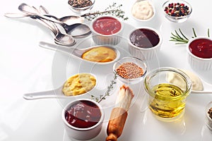 Assorted Condiments on White Wooden Table