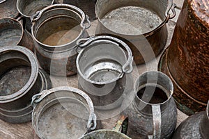Assorted copperware and rugs on flea market