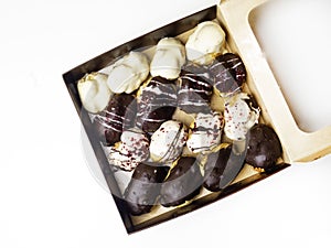 Assorted cream eclairs with chocolate glaze