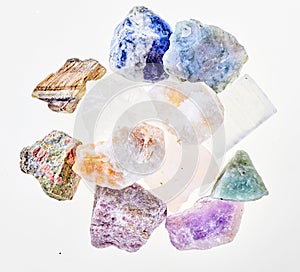 Assorted crystal healing stones on white