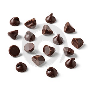 Assorted dark chocolate chips are scattered on a white background