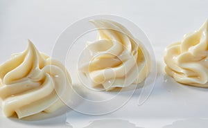 Assorted decorative twists of creamy mayonnaise photo