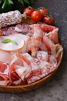 Assorted deli meats - ham, sausage, salami, parma, prosciutto