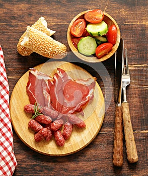 Assorted deli meats - ham, sausage, salami, prosciutto