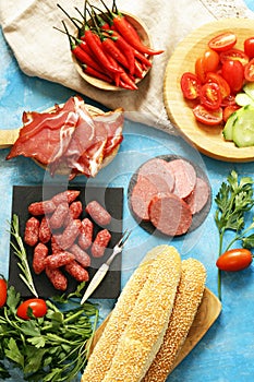 Assorted deli meats - ham, sausage, salami, prosciutto
