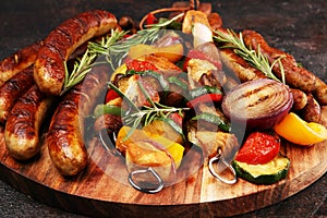 Assorted delicious grilled meat with vegetable on a barbecue with Grilled pork shish or kebab on skewers with vegetables