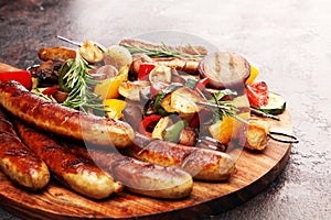 Assorted delicious grilled meat with vegetable on a barbecue with Grilled pork shish or kebab on skewers with vegetables