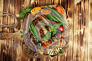 Assorted delicious grilled meat with vegetable on a barbecue. Grilled pork shish or kebab on skewers with vegetables . Food