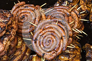 Assorted delicious grilled meat with vegetables over the counter on a barbecue event